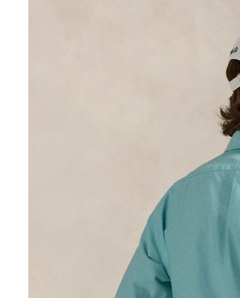 The oxford shirt made its debut very early in  Ralph Lauren Lauren’s designs, and since then, it has solidified its status as a pillar of the Polo look. Our fabric is developed with a secret wash, giving it instant character, ease and a heathered softness – what we refer to as "the perfect rumple". The formula is so unique that it's been kept in a safe for more than three decades. Today, Mr Lauren continues to create countless variations of his iconic shirt, including this Custom Fit version, which is embroidered with our multicoloured signature Pony.