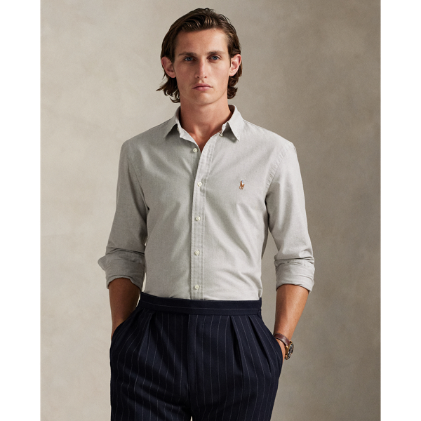 The oxford shirt made its debut very early in  Ralph Lauren Lauren’s designs, and since then, it has solidified its status as a pillar of the Polo look. Our fabric is developed with a secret wash, giving it instant character, ease and a heathered softness – what we refer to as "the perfect rumple". The formula is so unique that it's been kept in a safe for more than three decades. Today, Mr Lauren continues to create countless variations of his iconic shirt, including this Custom Fit version, which is embroidered with our multicoloured signature Pony.