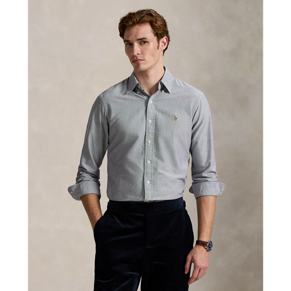 The oxford shirt made its debut very early in  Ralph Lauren Lauren’s designs, and since then, it has solidified its status as a pillar of the Polo look. Our fabric is developed with a secret wash, giving it instant character, ease and a heathered softness – what we refer to as "the perfect rumple". The formula is so unique that it's been kept in a safe for more than three decades. Today, Mr Lauren continues to create countless variations of his iconic shirt, including this Custom Fit version, which is embroidered with our multicoloured signature Pony.