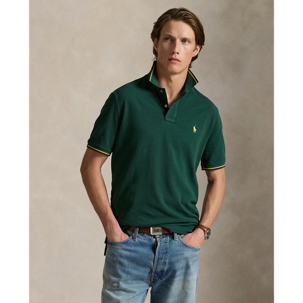 An American style standard since 1972, the Polo shirt has been imitated but never matched. Over the decades, Ralph Lauren Lauren has re-imagined his signature style in a wide array of colours and fits, yet all retain the quality and attention to detail of the iconic original. This trim version is made from our highly breathable cotton mesh, which offers a textured look and a soft feel.