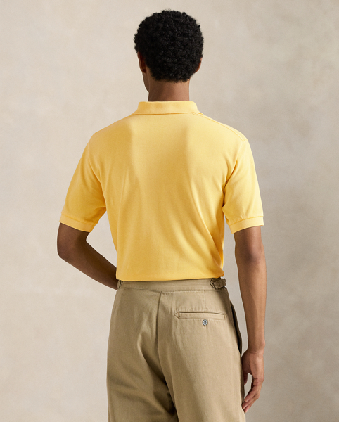 An American style standard since 1972, the Polo shirt has been imitated but never matched. Over the decades, Ralph Lauren Lauren has re-imagined his signature style in a wide array of colours and fits, yet all retain the quality and attention to detail of the initial icon. Treated for a timeworn look, this version is cut in our Original Fit, which is slightly more relaxed on the shoulder than our Classic Fit and has a longer back length.