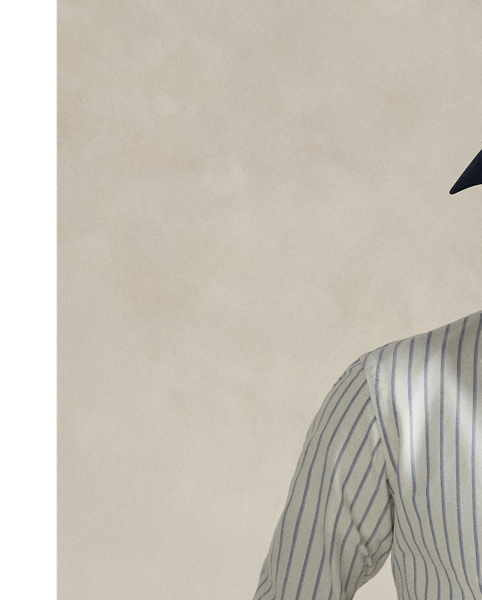 The oxford shirt made its debut very early in  Ralph Lauren Lauren’s designs, and since then, it has solidified its status as a pillar of the Polo look. Today, Mr Lauren continues to create countless variations of his iconic shirt, including this trim version, which is finished with a multicoloured signature embroidered Pony.