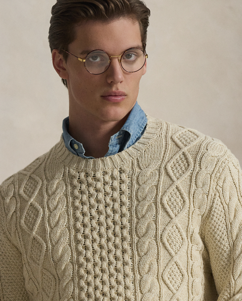The distinctive patterns that define the classic Aran jumper – a style favoured by 19th-century Irish fishermen for its unparalleled warmth and hard-wearing construction – were originally knit to signify the wearer's family clan. Polo's all-cotton version symbolises the wearer's membership in a different type of group: those who appreciate form, function and enduring style.
