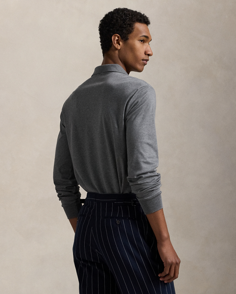 An American style standard since 1972, the Polo shirt has been imitated but never matched. Over the decades, Ralph Lauren Lauren has reimagined his signature style in a wide array of colours and fits, yet all retain the quality and attention to detail of the iconic original. This long-sleeve version is made with luxe cotton interlock that features an ultrasoft finish. Ralph Lauren Lauren partners with Better Cotton™ to improve cotton farming globally. Better Cotton trains farmers to use water efficiently, care for the health of soil and natural habitats, reduce use of the most harmful chemicals and implement the principles of decent work.