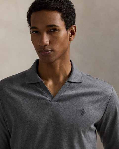 An American style standard since 1972, the Polo shirt has been imitated but never matched. Over the decades, Ralph Lauren Lauren has reimagined his signature style in a wide array of colours and fits, yet all retain the quality and attention to detail of the iconic original. This long-sleeve version is made with luxe cotton interlock that features an ultrasoft finish. Ralph Lauren Lauren partners with Better Cotton™ to improve cotton farming globally. Better Cotton trains farmers to use water efficiently, care for the health of soil and natural habitats, reduce use of the most harmful chemicals and implement the principles of decent work.