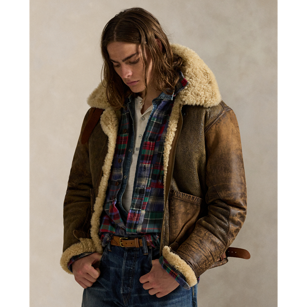 This lightweight bomber jacket is crafted from curly shearling and detailed throughout with full-grain leather piecing.