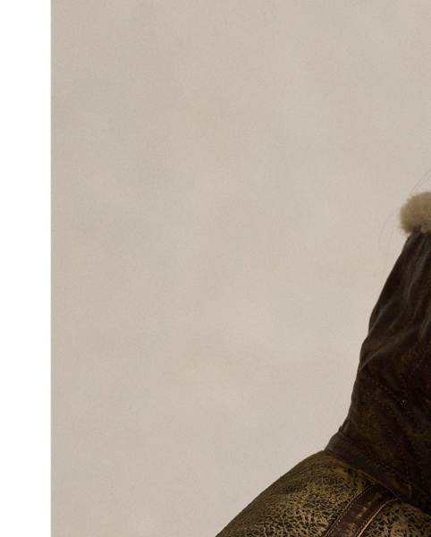 This lightweight bomber jacket is crafted from curly shearling and detailed throughout with full-grain leather piecing.