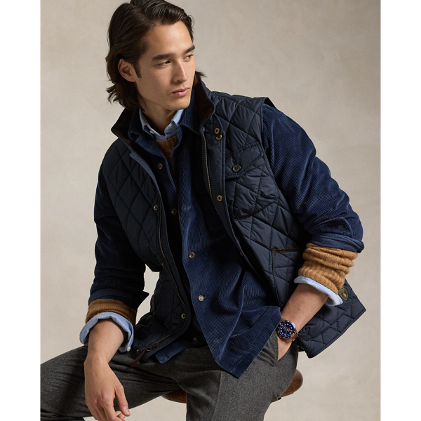 This gilet is crafted from water-repellent fabric and finished with a logo label for a signature Polo touch.