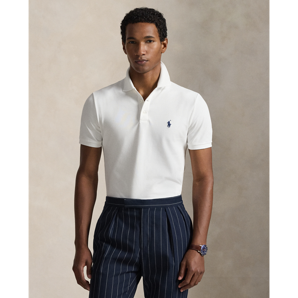 An American style standard since 1972, the Polo shirt has been imitated but never matched. Over the decades,  Ralph Lauren Lauren has re-imagined his signature style in a wide array of colours and fits, yet all retain the quality and attention to detail of the iconic original. This version includes a hint of stretch, allowing for unparalleled comfort and ease of movement. It is finished with genuine mother-of-pearl buttons on the placket.