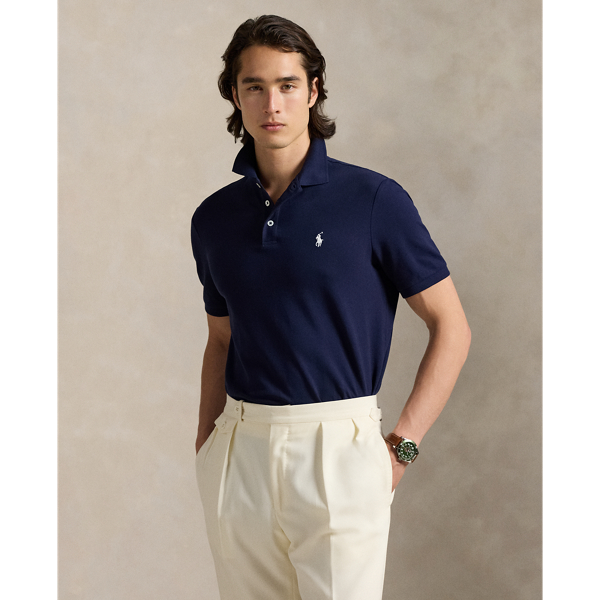 An American style standard since 1972, the Polo shirt has been imitated but never matched. Over the decades, Ralph Lauren Lauren has re-imagined his signature style in a wide array of colours and fits, yet all retain the quality and attention to detail of the iconic original. This version includes a hint of stretch, allowing for unparalleled comfort and ease of movement. It is finished with genuine mother-of-pearl buttons on the placket.
