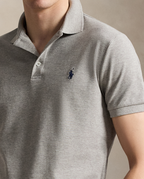 An American style standard since 1972, the Polo shirt has been imitated but never matched. Over the decades, Ralph Lauren Lauren has re-imagined his signature style in a wide array of colours and fits, yet all retain the quality and attention to detail of the iconic original. This version includes a hint of stretch, allowing for unparalleled comfort and ease of movement. It is finished with genuine mother-of-pearl buttons on the placket.
