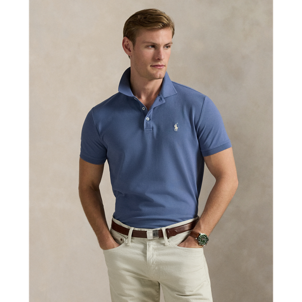 An American style standard since 1972, the Polo shirt has been imitated but never matched. Over the decades,  Ralph Lauren Lauren has re-imagined his signature style in a wide array of colours and fits, yet all retain the quality and attention to detail of the iconic original. This version includes a hint of stretch, allowing for unparalleled comfort and ease of movement. It is finished with genuine mother-of-pearl buttons on the placket.