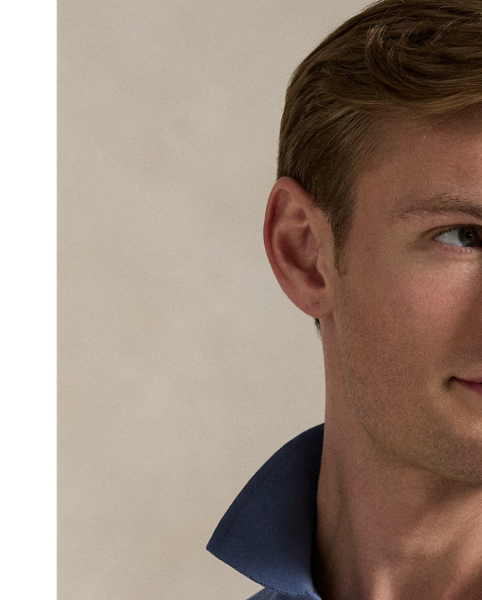 An American style standard since 1972, the Polo shirt has been imitated but never matched. Over the decades,  Ralph Lauren Lauren has re-imagined his signature style in a wide array of colours and fits, yet all retain the quality and attention to detail of the iconic original. This version includes a hint of stretch, allowing for unparalleled comfort and ease of movement. It is finished with genuine mother-of-pearl buttons on the placket.