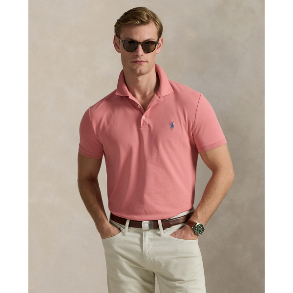 An American style standard since 1972, the Polo shirt has been imitated but never matched. Over the decades, Ralph Lauren Lauren has re-imagined his signature style in a wide array of colours and fits, yet all retain the quality and attention to detail of the iconic original. This version includes a hint of stretch, allowing for unparalleled comfort and ease of movement. It is finished with genuine mother-of-pearl buttons on the placket.