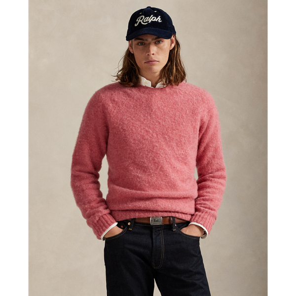 Available in an array of bright colours, this jumper is made in Scotland using thick-gauge wool yarn and a seamless circular-knitting technique.