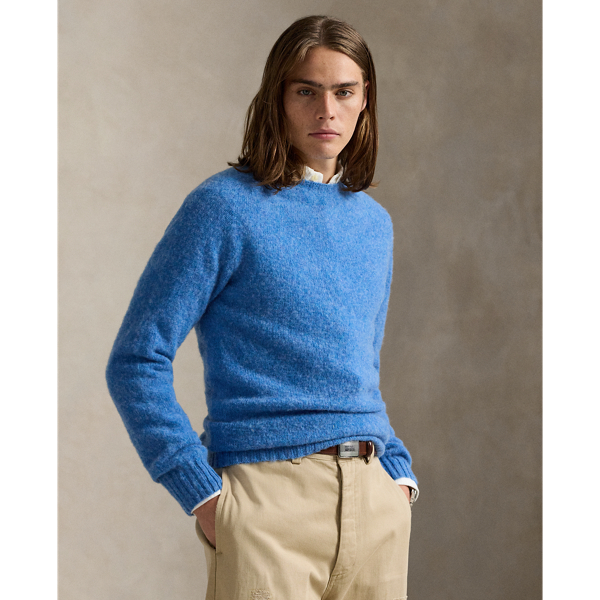 Available in an array of bright colours, this jumper is made in Scotland using thick-gauge wool yarn and a seamless circular-knitting technique.