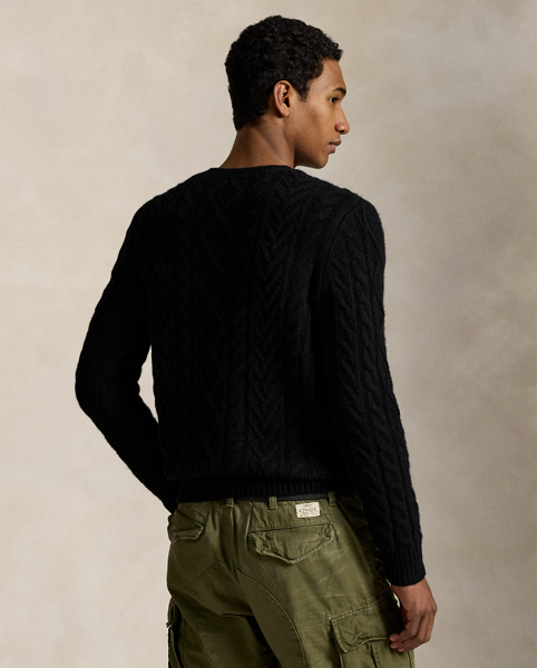 The distinctive patterns that define the classic Aran jumper – a style favoured by 19th-century Irish fishermen for its unparalleled warmth and hard-wearing construction – were originally knit to signify the wearer's family clan. Polo's version, which is made with a wool-and-alpaca hair blend, symbolises the wearer's membership in a different type of group: those who appreciate form, function and enduring style.