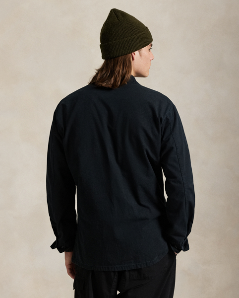 This overshirt merges durable cotton ripstop with a utilitarian-inspired silhouette and a special wash treatment that creates a distressed effect.
