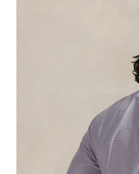 This shirt is crafted from silky cotton poplin and features an elegant Glen plaid pattern.