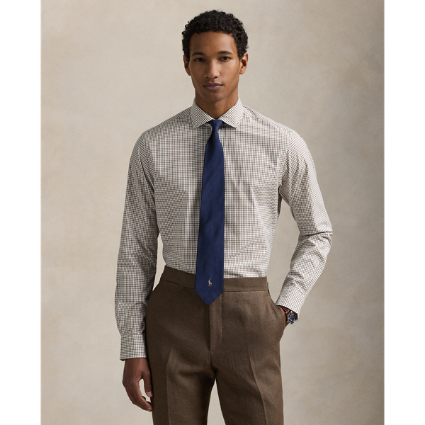 This shirt is crafted from silky cotton poplin and features an elegant Glen plaid pattern.
