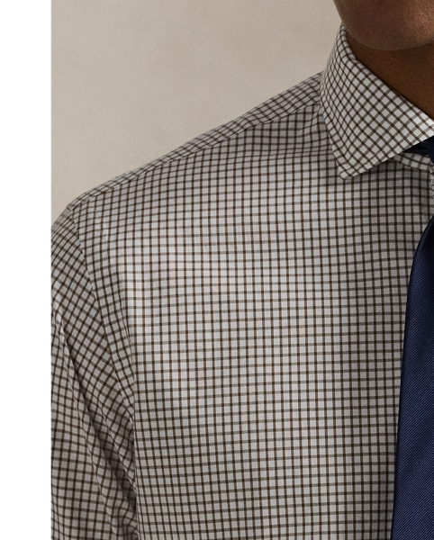 This shirt is crafted from silky cotton poplin and features an elegant Glen plaid pattern.
