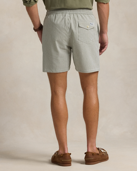 Stretch seersucker and bengal stripes give these mesh-lined swimming trunks an iconic Polo look.