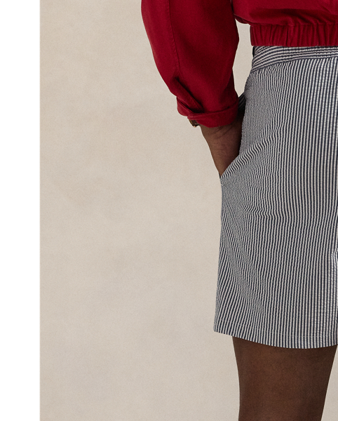 Stretch seersucker and bengal stripes give these mesh-lined swimming trunks an iconic Polo look.