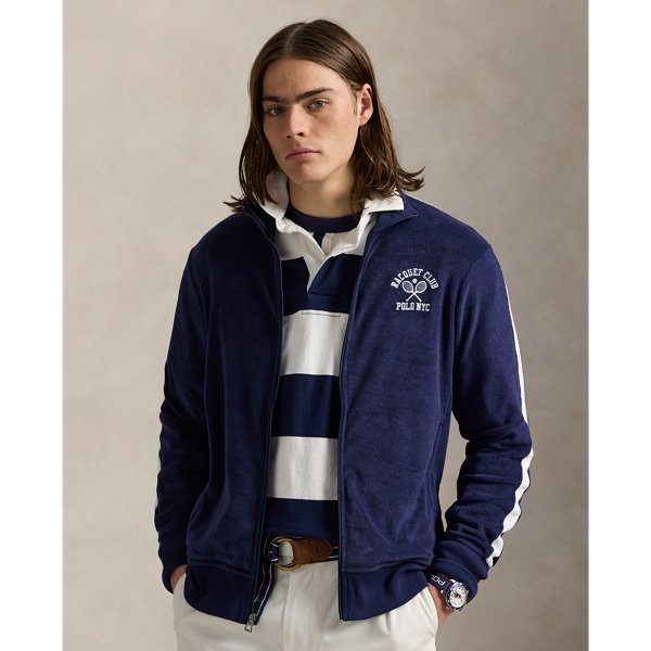 Crafted with a lightweight cotton blend, this track jacket features sporty stripes and tennis-inspired embroidery on the chest.