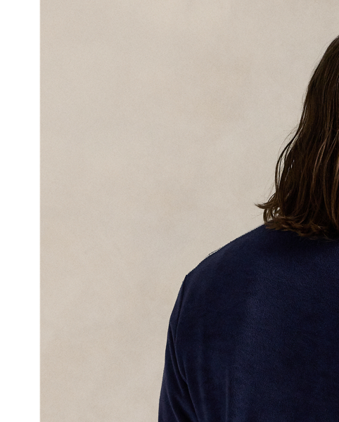 Crafted with a lightweight cotton blend, this track jacket features sporty stripes and tennis-inspired embroidery on the chest.