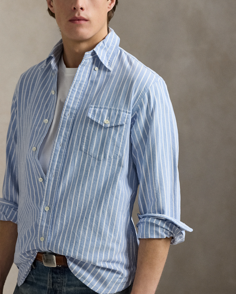 The oxford shirt made its debut very early in Ralph Lauren Lauren’s designs, and since then, it has solidified its status as a pillar of the Polo look. Our fabric is developed with a secret wash, which gives it instant character, ease and a heathered softness. The formula is so unique that it's been kept in a safe for more than three decades. In addition to details evoking its prep-school inspiration, it offers a relaxed feel, producing what we refer to as "the perfect rumple." Today, Mr Lauren continues to create countless variations of his iconic shirt, including this striped version that is finished with our signature embroidered Pony.