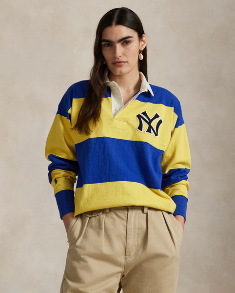 As a boy growing up in the Bronx, Mr Lauren loved going to Yankee Stadium™ to watch his hometown heroes play ball. This unisex rugby shirt celebrates Mr Lauren's long-standing love of the Bronx Bombers™ and the game of baseball with a New York Yankees™ logo patch. Made from striped cotton jersey, it features our signature embroidered Pony and appliqués spelling out "New York".