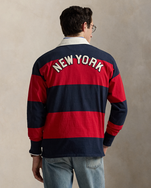 As a boy growing up in the Bronx, Mr Lauren loved going to Yankee Stadium™ to watch his hometown heroes play ball. This unisex rugby shirt celebrates Mr Lauren's long-standing love of the Bronx Bombers™ and the game of baseball with a New York Yankees™ logo patch. Made from striped cotton jersey, it features our signature embroidered Pony and appliqués spelling out "New York".