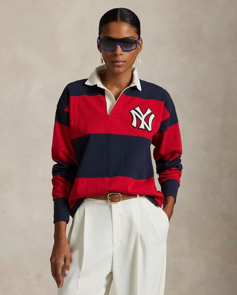 As a boy growing up in the Bronx, Mr Lauren loved going to Yankee Stadium™ to watch his hometown heroes play ball. This unisex rugby shirt celebrates Mr Lauren's long-standing love of the Bronx Bombers™ and the game of baseball with a New York Yankees™ logo patch. Made from striped cotton jersey, it features our signature embroidered Pony and appliqués spelling out "New York".