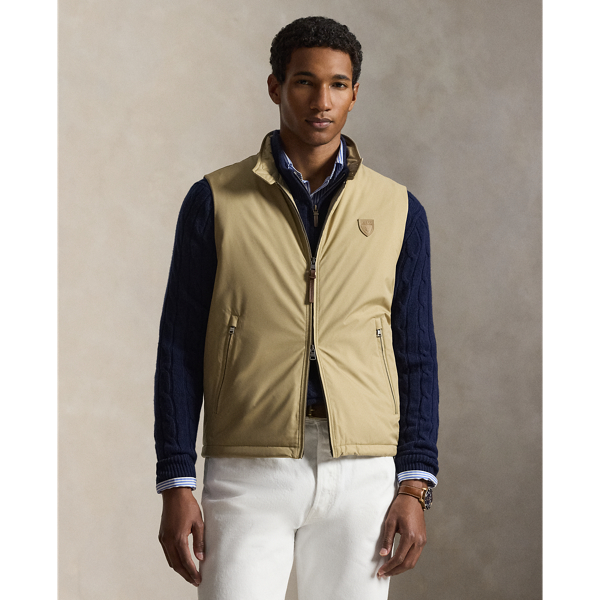 This gilet is crafted from water-resistant twill and insulated with ultra-lightweight down-alternative fill. Thoughtfully constructed, it features suede and leather details as well as a comfortable stretch jersey lining.