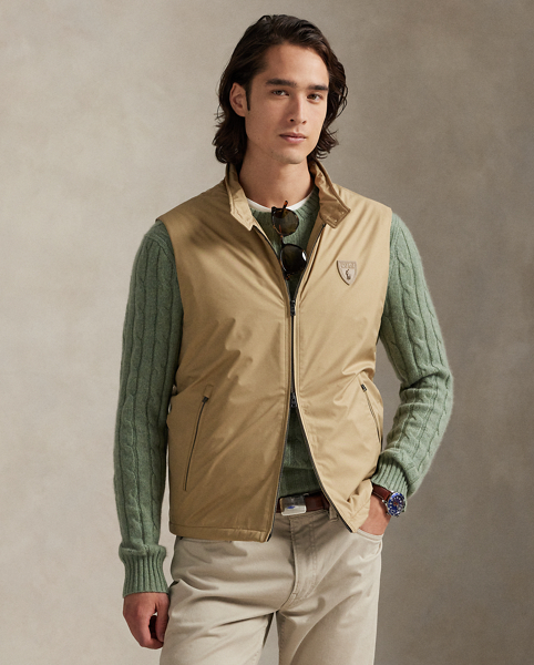 This gilet is crafted from water-resistant twill and insulated with ultra-lightweight down-alternative fill. Thoughtfully constructed, it features suede and leather details as well as a comfortable stretch jersey lining.