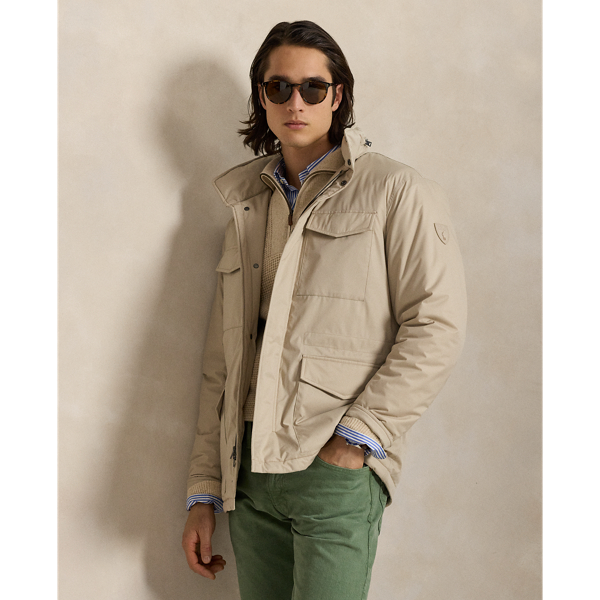 This jacket is crafted from water-resistant twill and insulated with ultra-lightweight down-alternative fill. Thoughtfully constructed, it features a stowaway hood and comfortable stretch jersey lining.