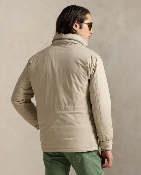 This jacket is crafted from water-resistant twill and insulated with ultra-lightweight down-alternative fill. Thoughtfully constructed, it features a stowaway hood and comfortable stretch jersey lining.