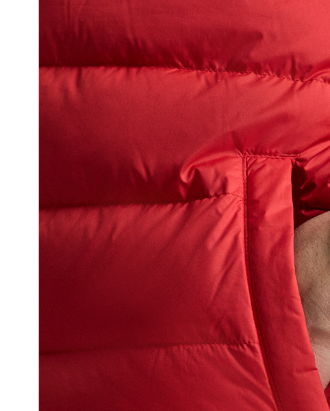 This jacket is crafted from a matte water-repellent fabric and insulated with 650-fill-power down. It also packs into its own pocket for on-the-go convenience.