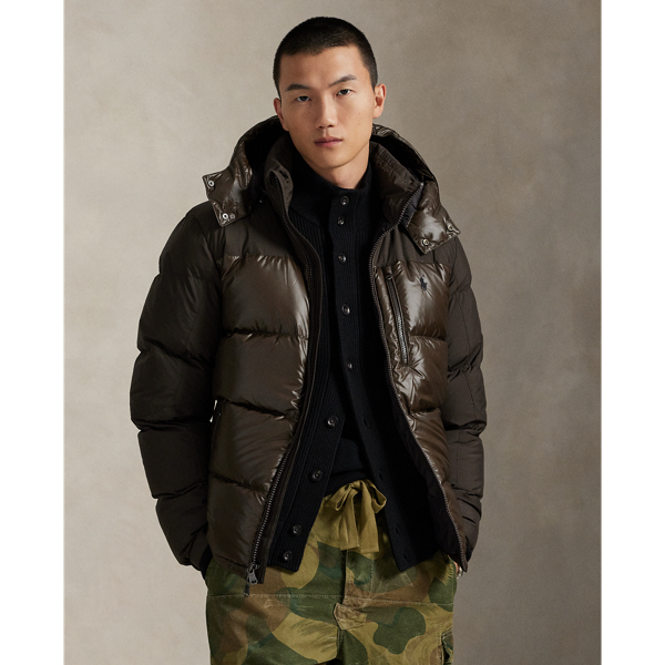 Made from water-repellent fabric, this jacket is insulated with 650-fill-power down and constructed with a detachable hood. A tonal combination of matted and glossed panels provides a modern take on texture.