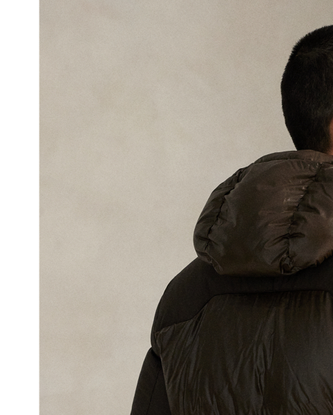 Made from water-repellent fabric, this jacket is insulated with 650-fill-power down and constructed with a detachable hood. A tonal combination of matted and glossed panels provides a modern take on texture.