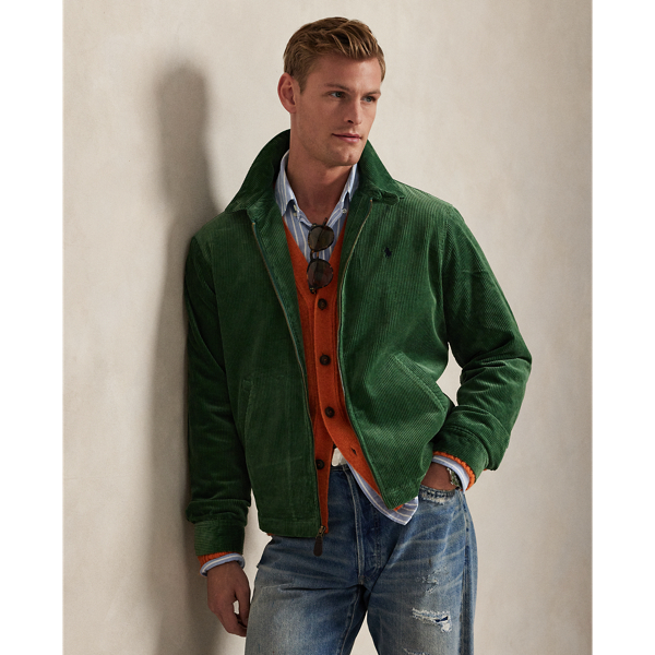 This cotton jacket contrasts the sporty silhouette of a windbreaker with the rustic texture of wide-wale corduroy. It is dyed in a custom-developed colour and finished with considered details, such as tartan-inspired lining and leather accents.