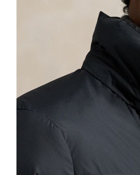 Made from water-repellent ripstop fabric, this jacket is insulated with 650-fill-power down and constructed with a detachable hood.