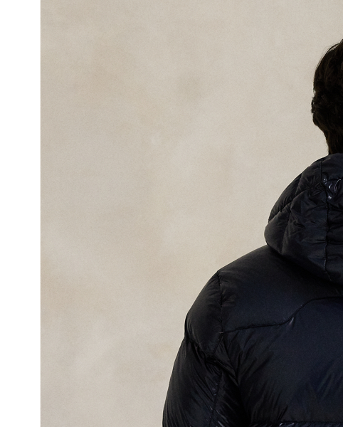 Made from water-repellent ripstop fabric, this glossed jacket is insulated with 650-fill-power down and constructed with a detachable hood.