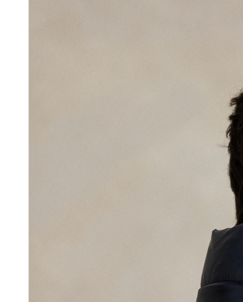 Made from water-repellent ripstop fabric, this glossed jacket is insulated with 650-fill-power down and constructed with a detachable hood.