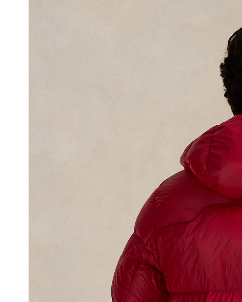 Made from water-repellent ripstop fabric, this glossed jacket is insulated with 650-fill-power down and constructed with a detachable hood.