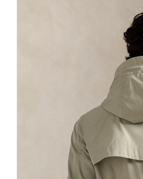 Crafted from water-repellent fabric, this jacket features functional details, such as a mesh-lined vented back and metal grommets on the underarms for breathability.