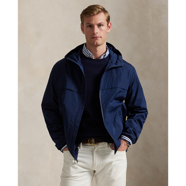 Crafted from water-repellent fabric, this jacket features functional details, such as a mesh-lined vented back and metal grommets on the underarms for breathability.