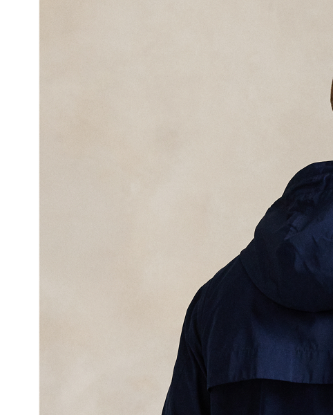 Crafted from water-repellent fabric, this jacket features functional details, such as a mesh-lined vented back and metal grommets on the underarms for breathability.