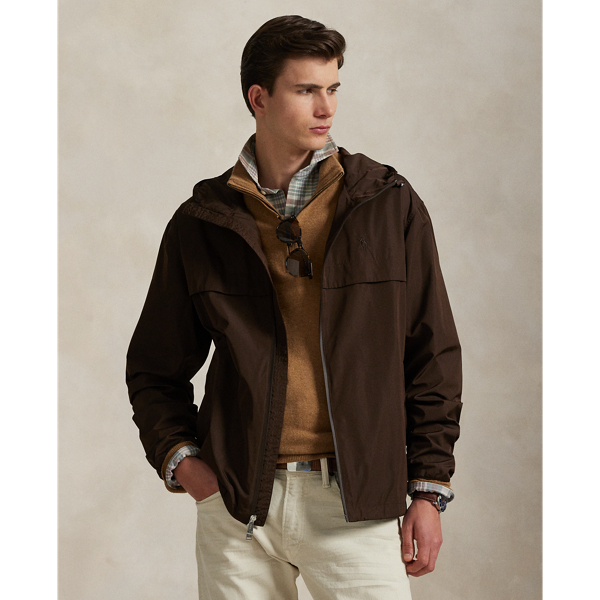 Crafted from water-repellent fabric, this jacket features functional details, such as a mesh-lined vented back and metal grommets on the underarms for breathability.