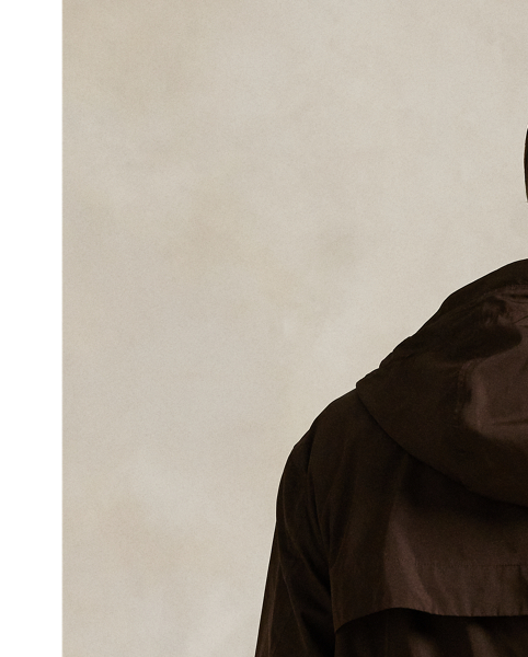 Crafted from water-repellent fabric, this jacket features functional details, such as a mesh-lined vented back and metal grommets on the underarms for breathability.